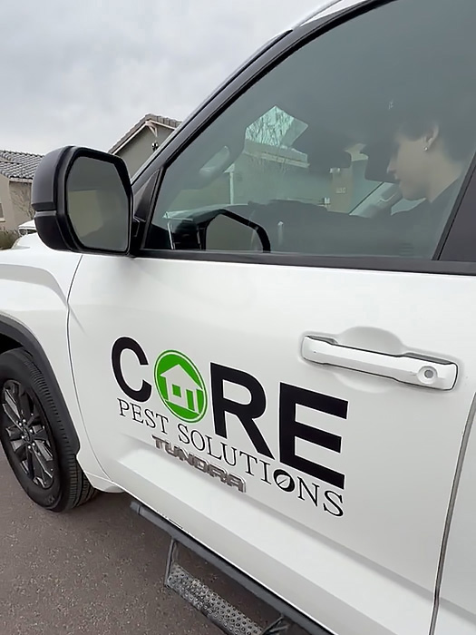 Sideview of Core Pest Solutions Service Vehicle