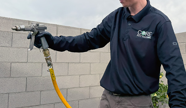 Technician Applying Pest Treatment Technician Applying Pest Treatment